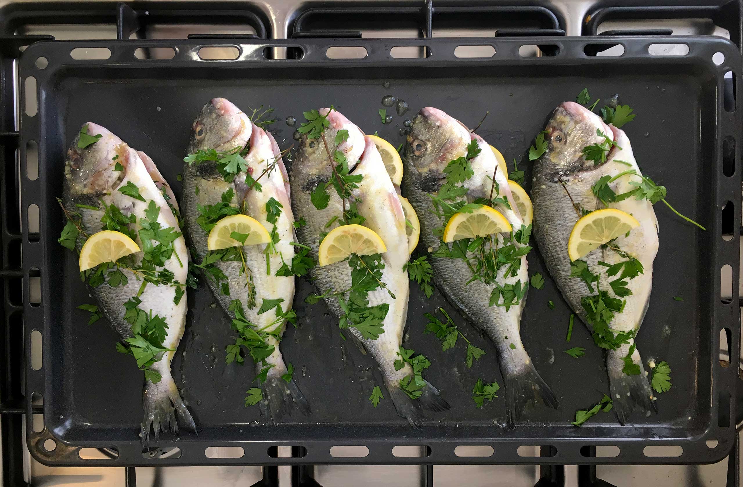 Place some parsely and thyme on the sea bream