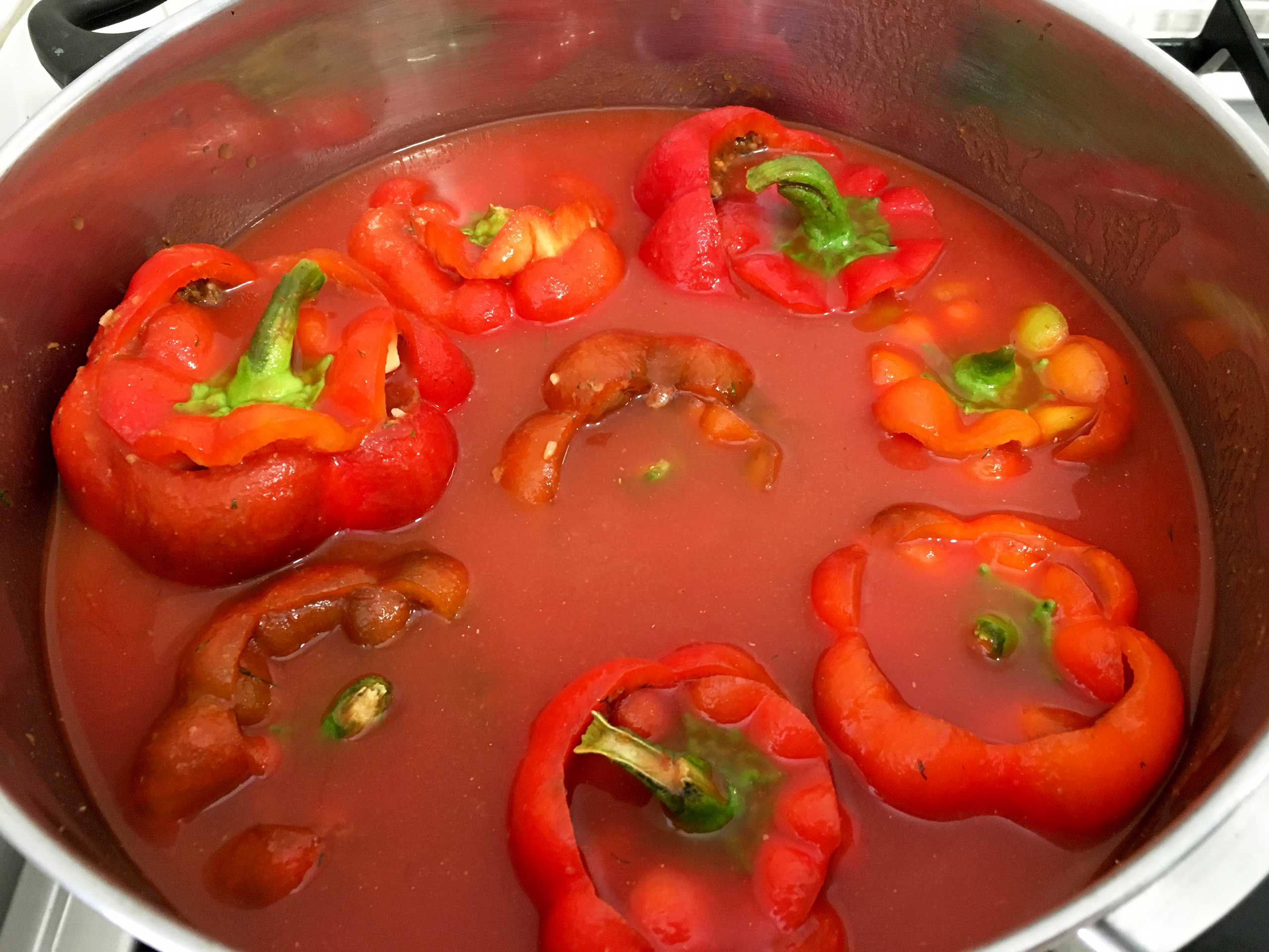add sauce to the stuffed peppers