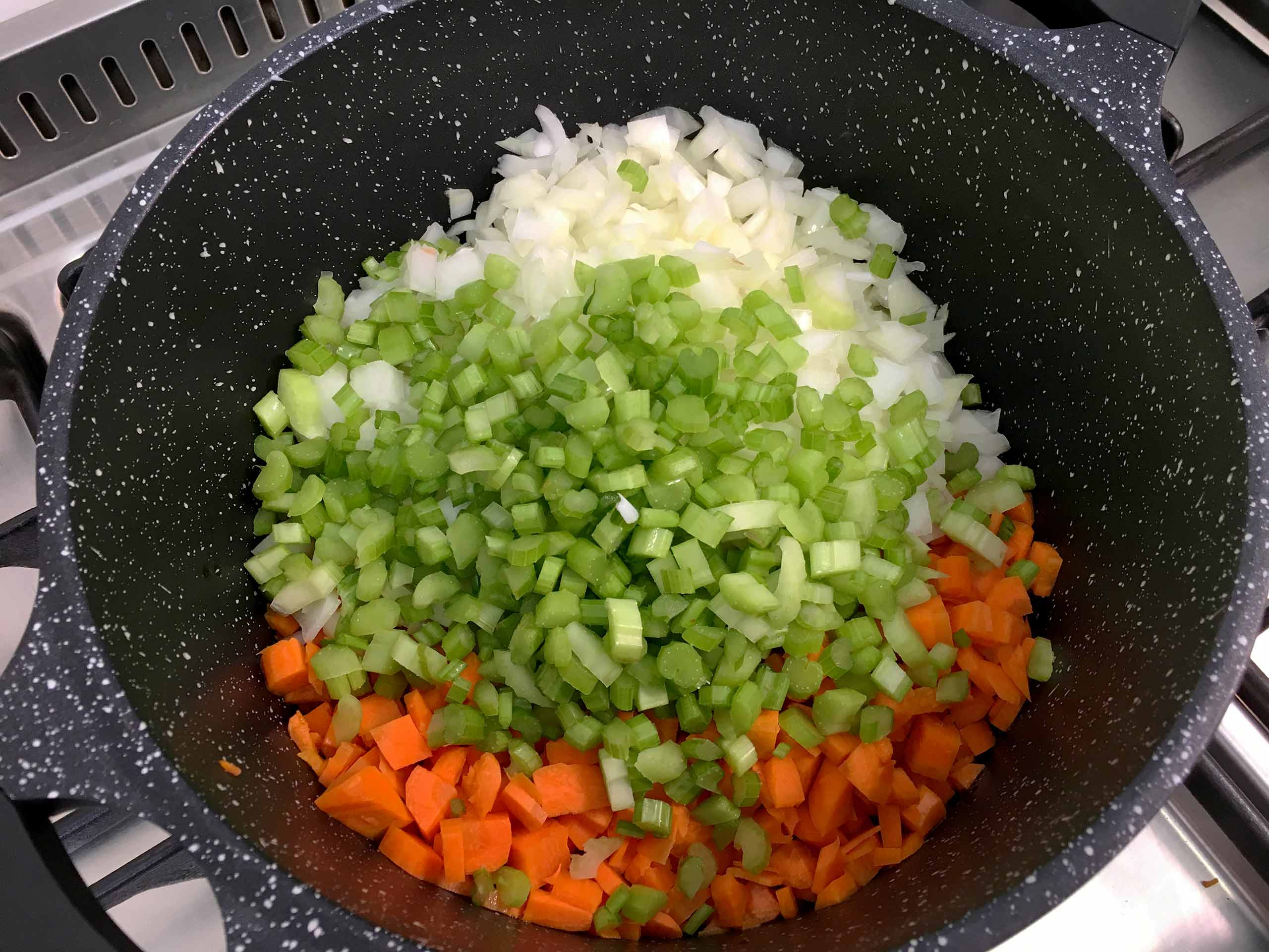 adding vegetables to the bolognese sauce