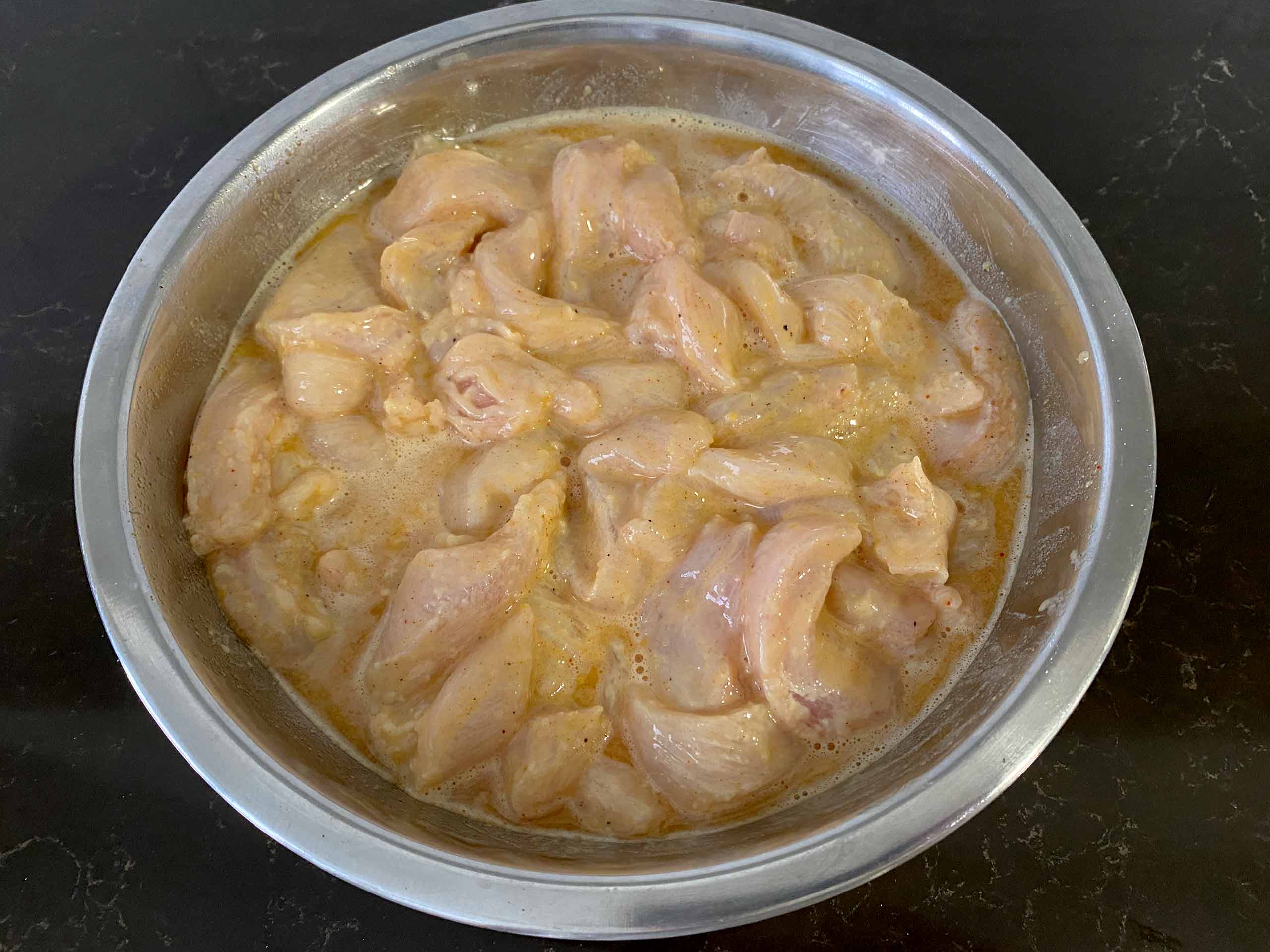 Mix the chicken breast in the batter until it is all well coated.