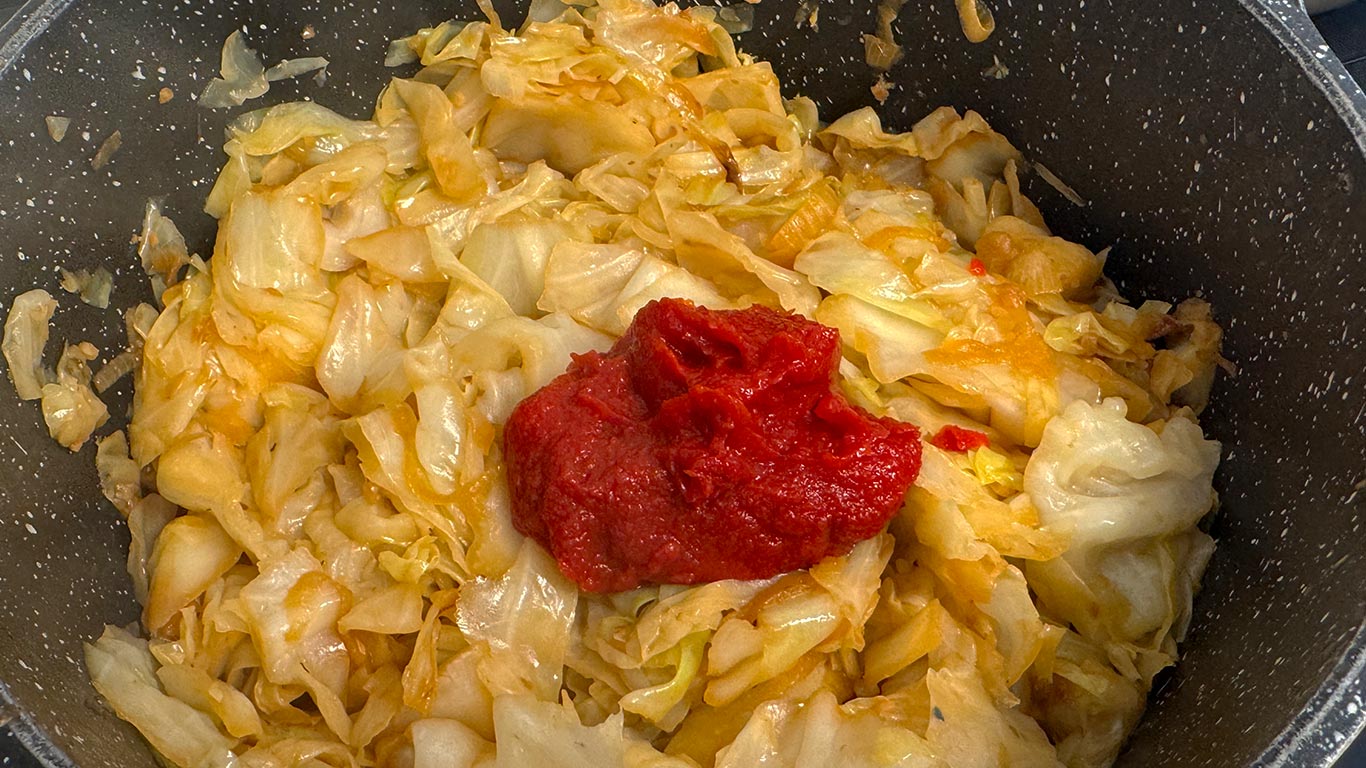 Tomato paste added to the braised cabbage