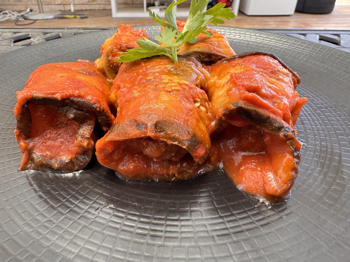 Eggplant rolls stuffed with meat, served