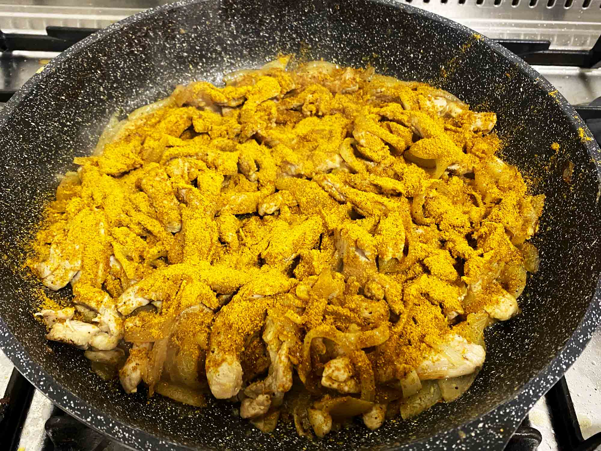 Shawarma spice sprinkled over the chicken