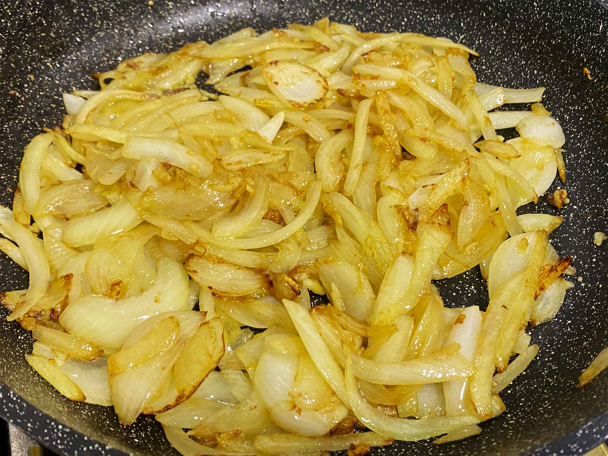 Golden caramelized onions in a skillet